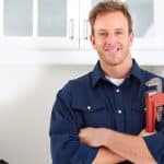 Professional plumber holding a wrench